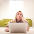 girl thinking with laptop