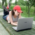 girl on laptop working outside