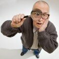 old man with magnifying glass