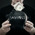 Man holding piggy bank
